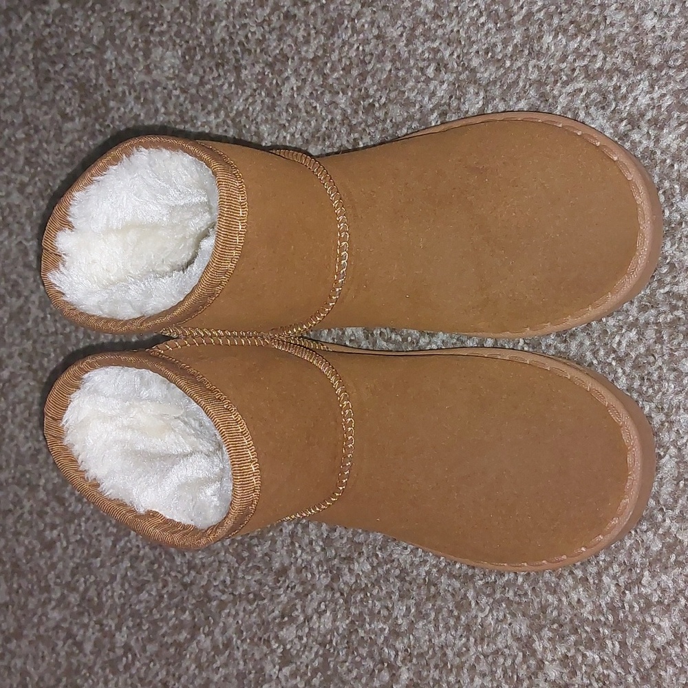 Tan boots with faux fur inside.
